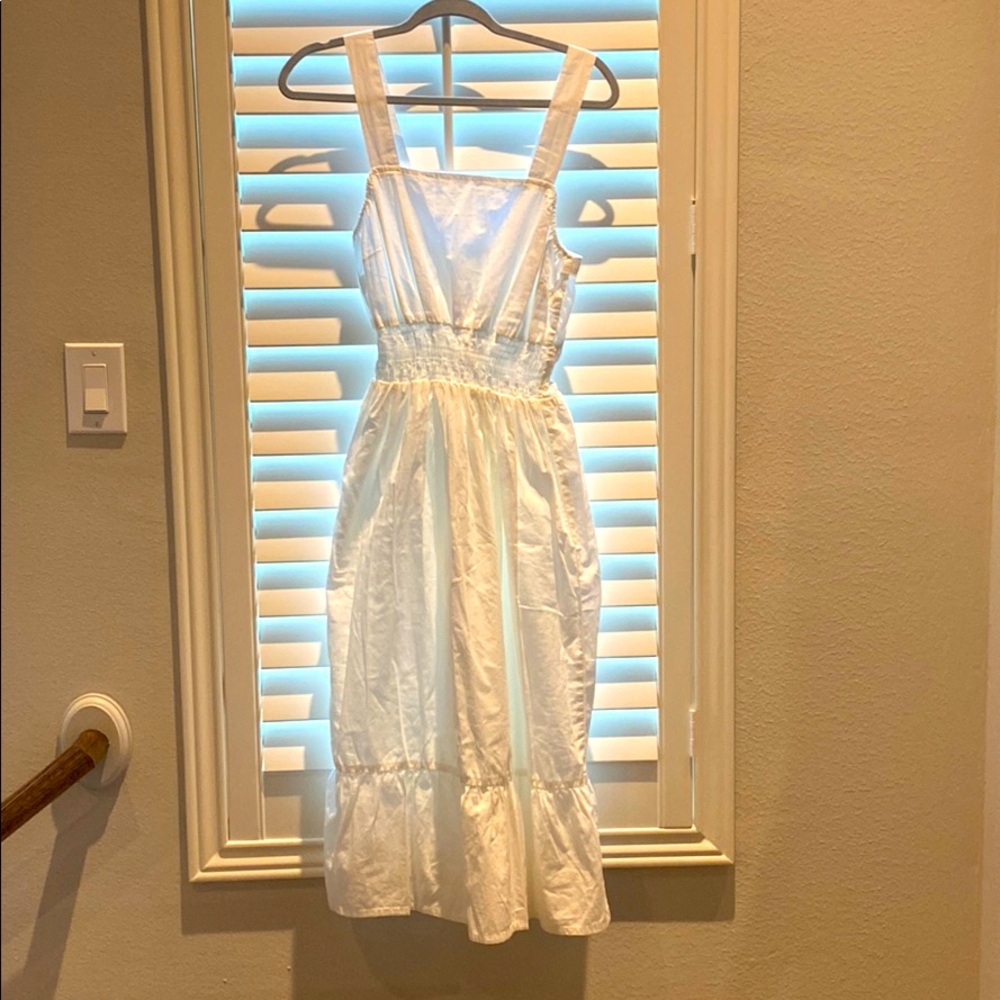 Carolyn Miranda the drop white strapped midi dress